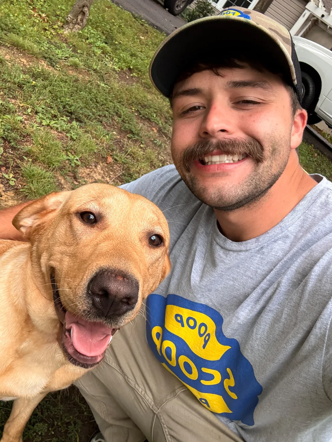 Poop Scoop Pros owner with a happy dog